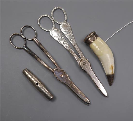 Two pairs of silver plated grape scissors, a white metal travelling corkscrew and a mounted animal tooth vinaigrette.